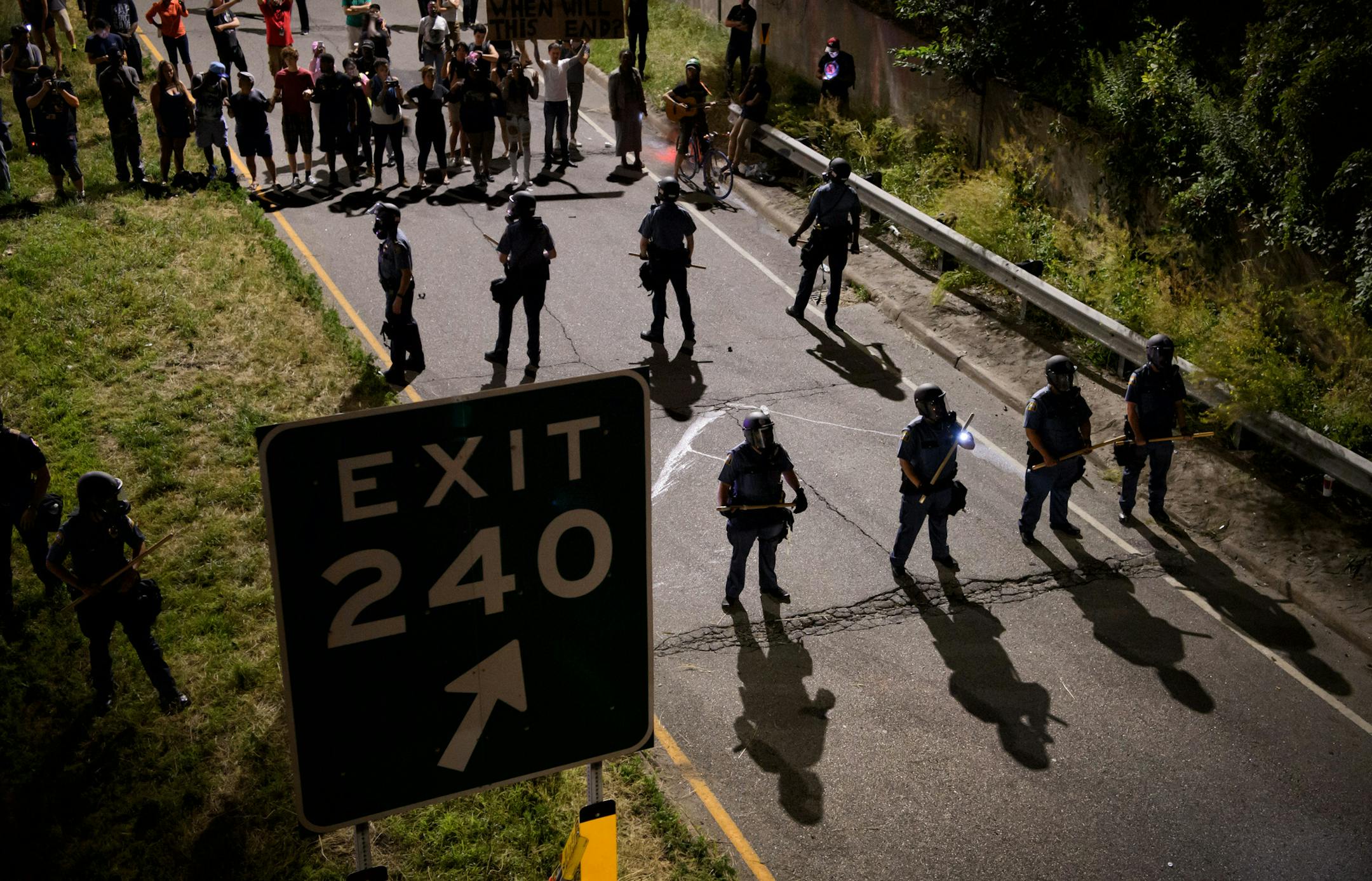 St. Paul Police guarded the exit ramp. They wanted protesters to go back not forward. ] GLEN STUBBE * gstubbe@startribune.com Friday, July 8, 2016 Black Lives Matter protest started in front of the Governor's Residence on Summit Avenue. From there protesters marched onto Lexington Ave and turned onto I-94 which they occupied for four hours.