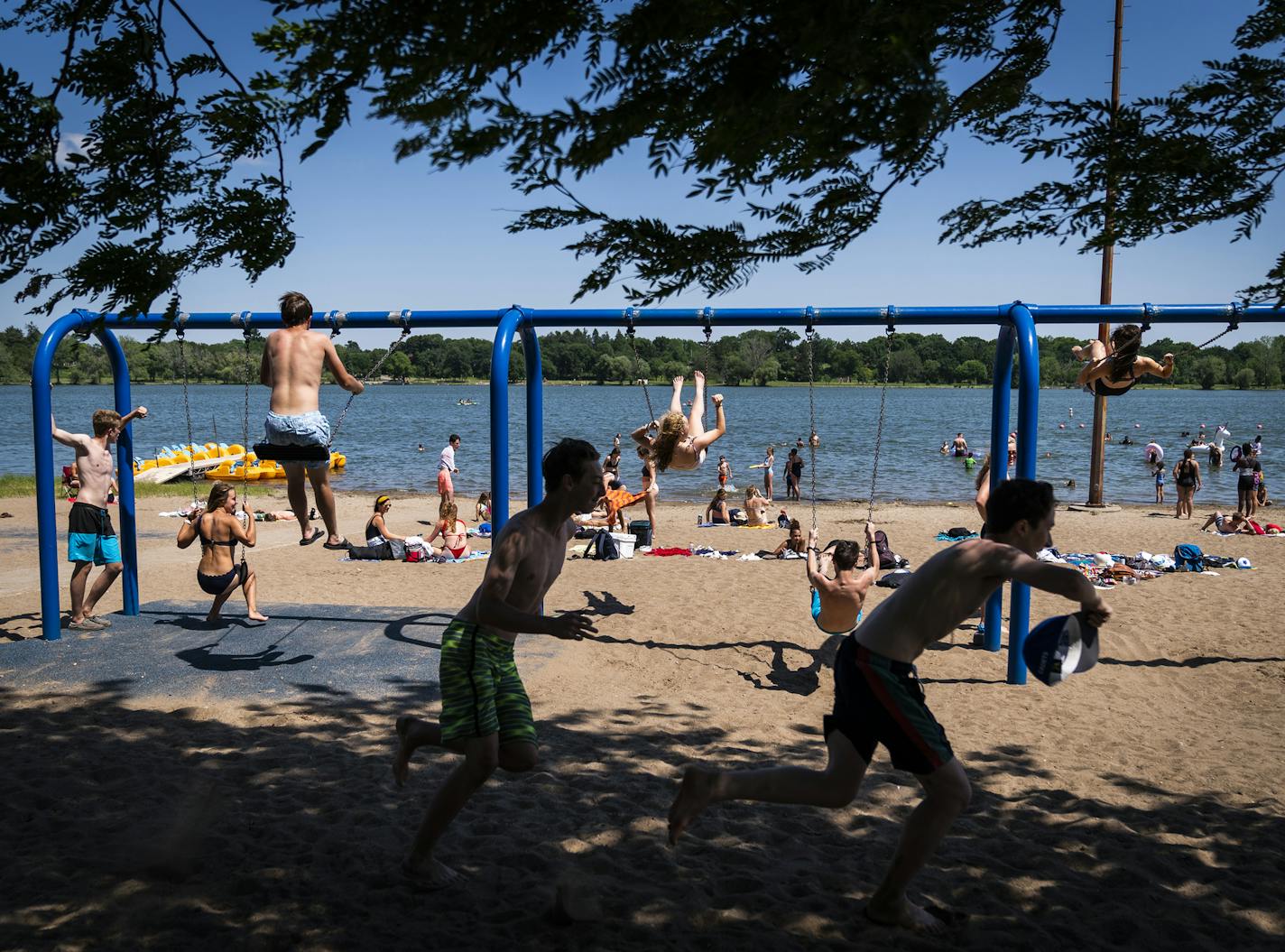 Young people enjoyed the beach at Lake Nokomis on Wednesday, a hot summer day.