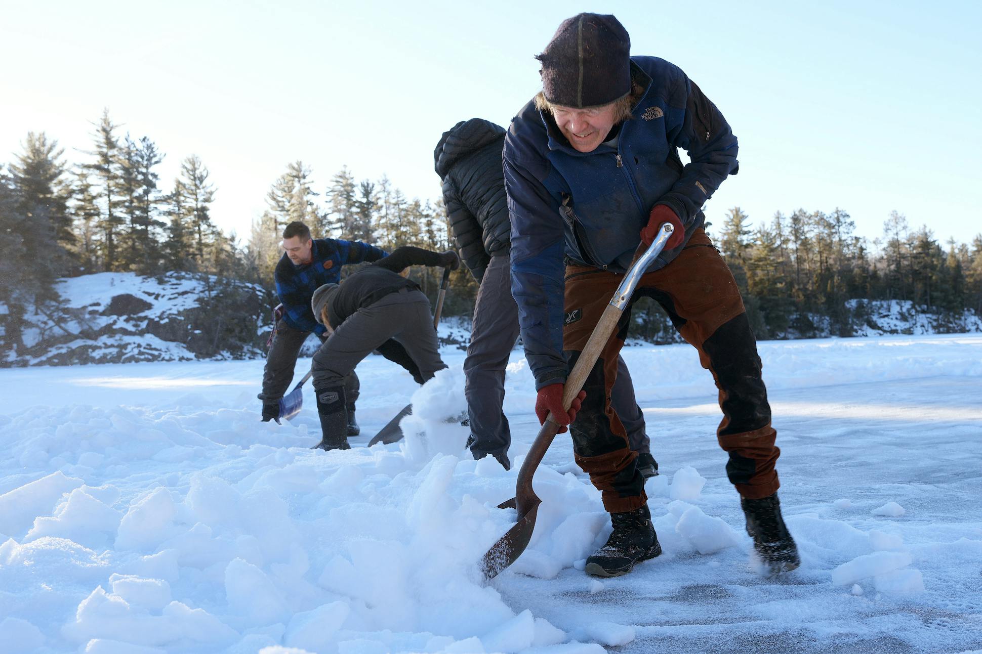 Will Steger, along with a group of friends and volunteers, shoveled snow from the ice on Pickett's Lake at his Steger Wilderness Center in preparation for the annual Ice Ball ice harvest on Feb. 3 in Ely.