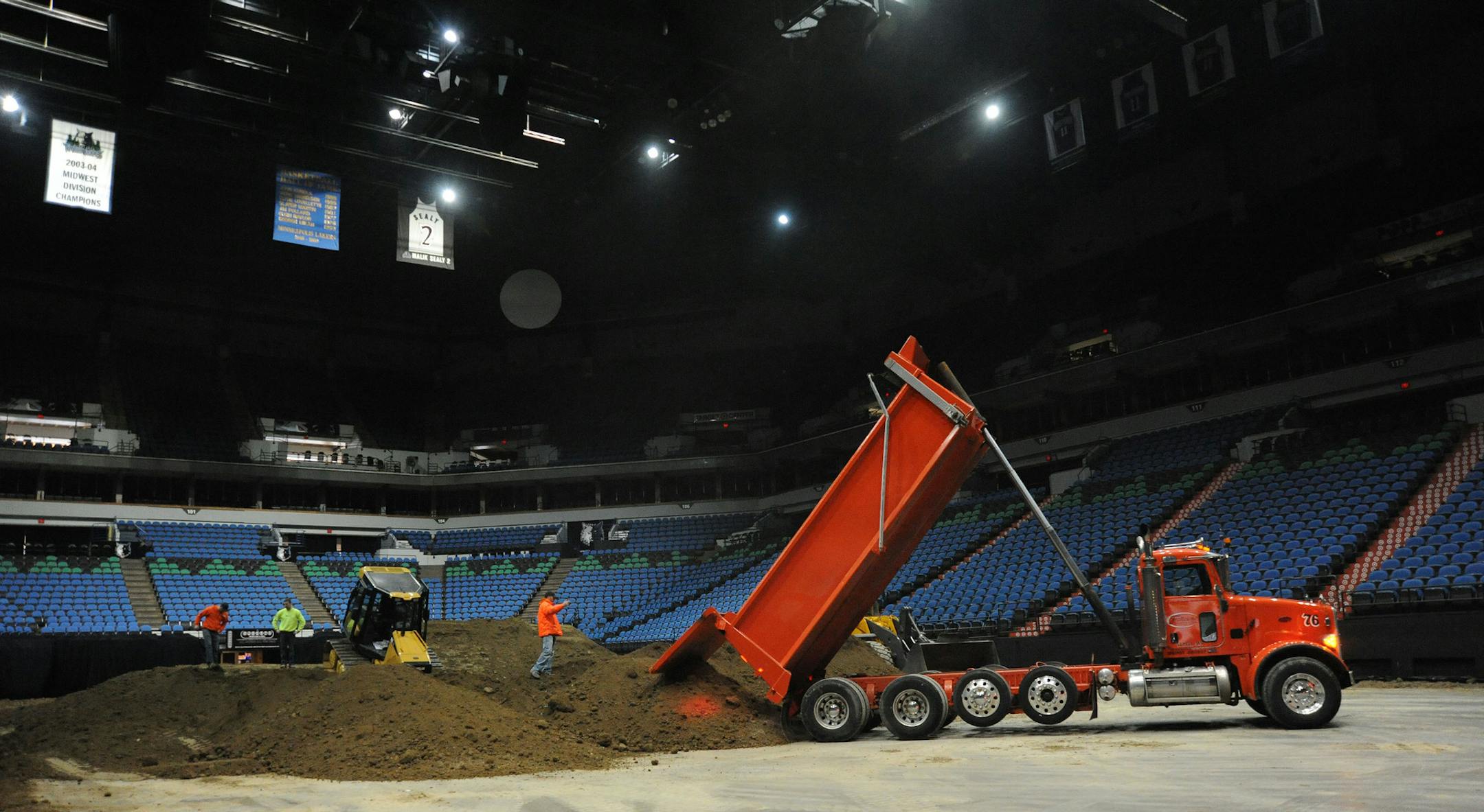 The leisure and hospitality sector gained the most workers in January. Pictured are workers getting Target Center ready for the AMA Arenacross Series in February. (RICHARD SENNOTT/Richard.Sennott@startribune.com)