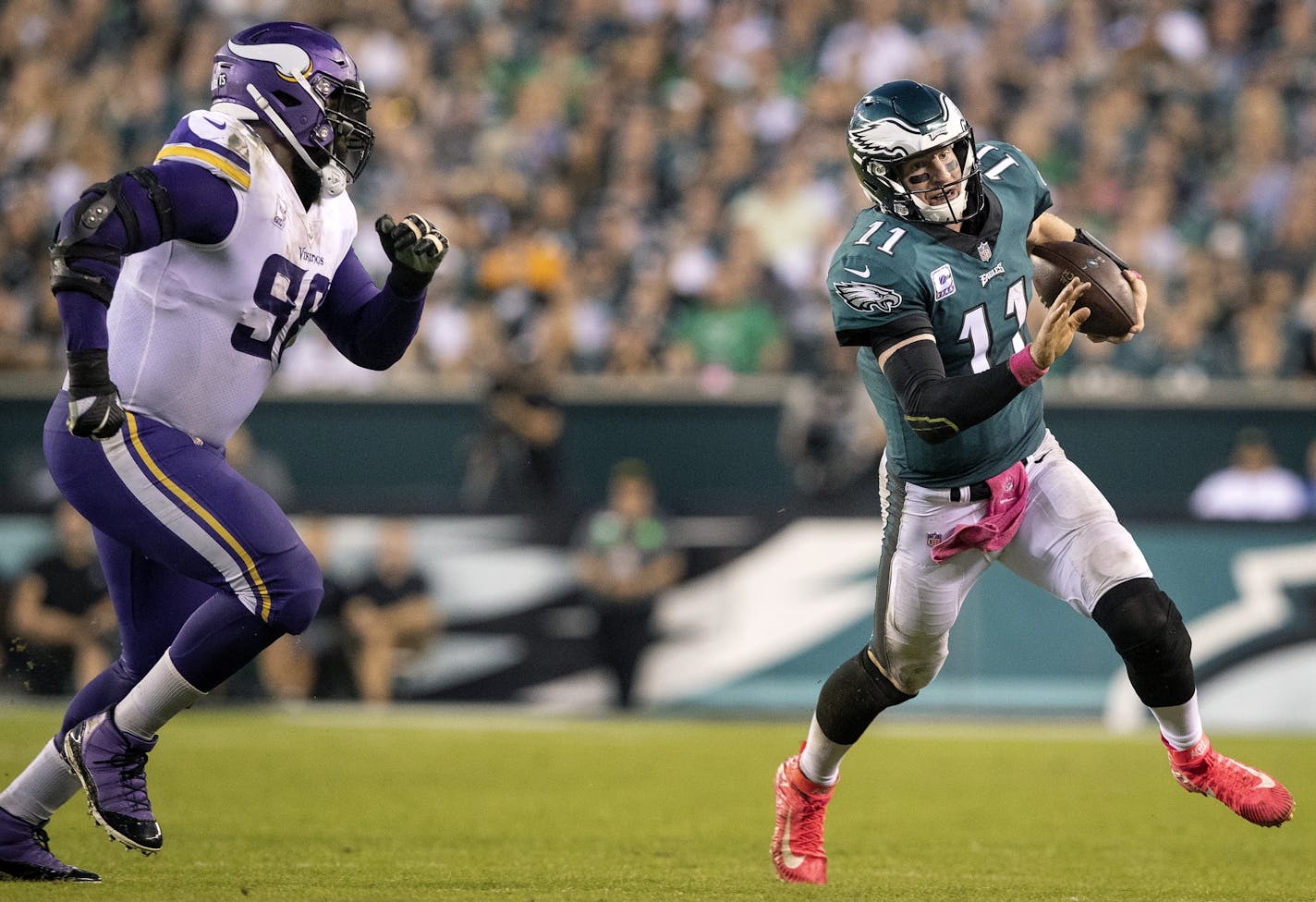 Carson Wentz (17) was chased by Linval Joseph (98) in the fourth quarter.