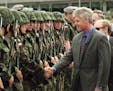 President Clinton greets Polish troops upon arriving at Warsaw Airport Thursday July 10 1997. Poland, the next in line to join NATO, embraced Presiden
