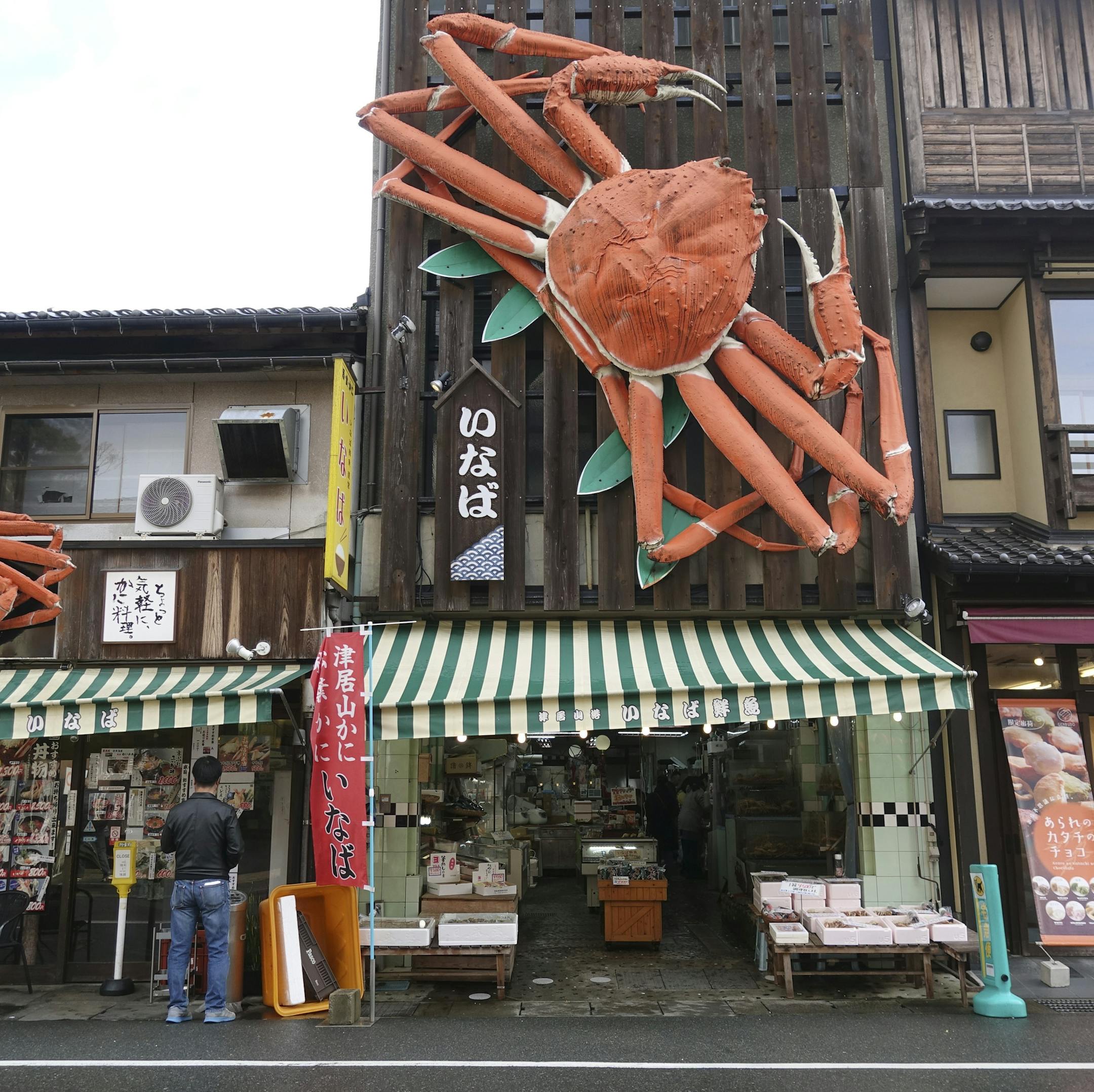 A street in Kinosaki, which is famous for snow crabs, in Japan, Nov. 2018. Our 52 Places columnist tries on traditional robes and footwear; learns to enjoy seafood (as long as it’s not chewy); and discovers (once again) how small the world is. (Jada Yuan/The New York Times)