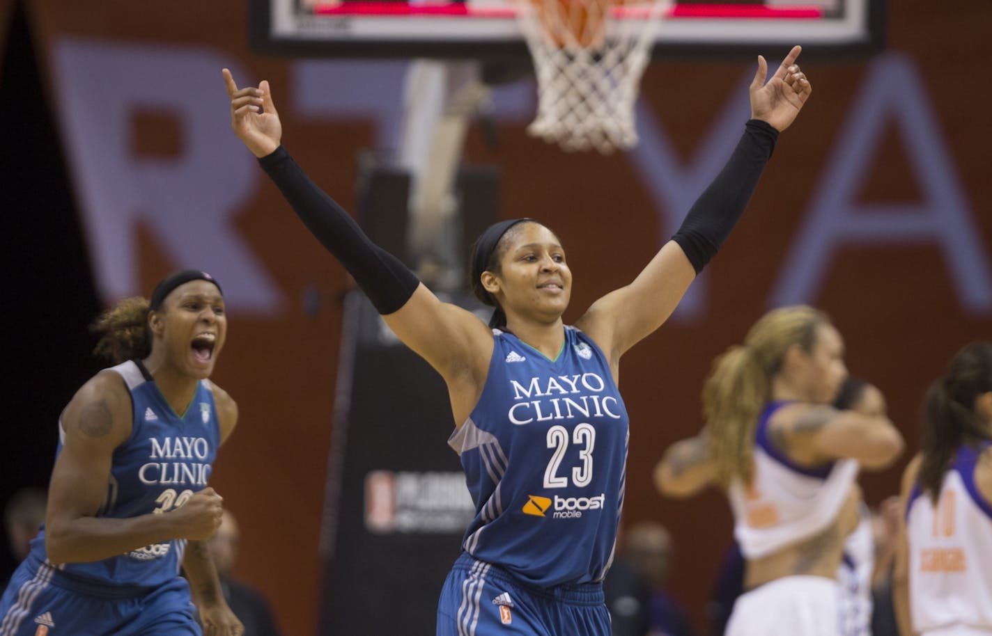 Lynx' Maya Moore (23) celebrates making a steal and game winning free throw against the Mercury during game 2 of the Western Conference Finals at Talking Stick Resort Arena in Phoenix, AZ on September 27, 2015.