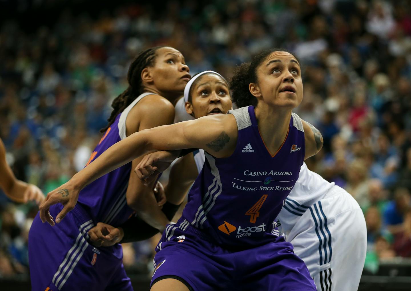 Lynx forward Maya Moore (23) watched for a rebound after a second half free throw with Phoenix Mercury forwards Candice Dupree (4) and Monique Currie (25).