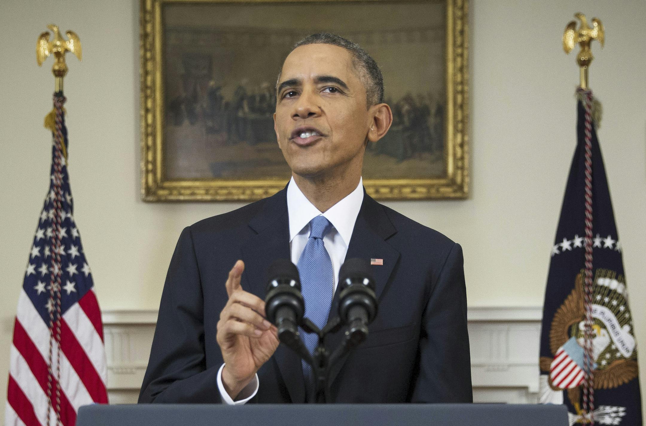 President Barack Obama delivers an address about policy changes with Cuba, in the Cabinet Room of the White House, in Washington, Dec. 17, 2014. Obama announced Wednesday that the U.S. would ‚Äúend an outdated approach‚Äù by fully restoring diplomatic relations with Cuba, and open an embassy in Havana for the first time in more than a half-century following the release of an American contractor held in prison in Cuba for five years. (Doug Mills/The New York Time