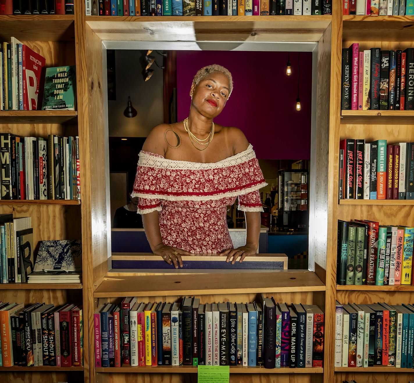 "The Stars and the Blackness Between Them" portrays black youth "a way that I'd never seen myself depicted as a young kid," says author Junauda Petrus, pictured at Moon Palace Books in Minneapolis.