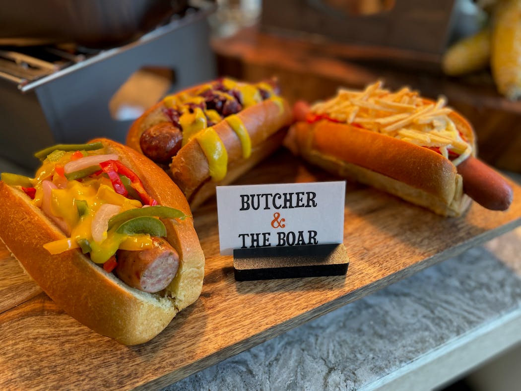 Butcher & the Boar is serving a footlong, hot link, and cheddarwurst at Target Center.