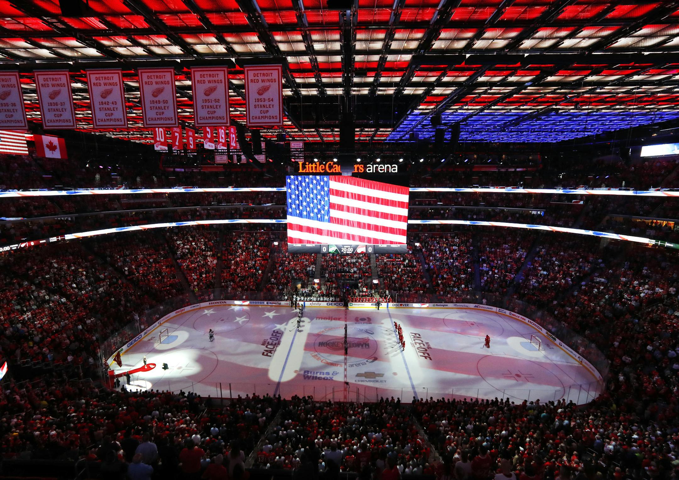The national anthem is played before the Detroit Red Wings-Minnesota Wild NHL hockey game Thursday, Oct. 5, 2017, in Detroit. (AP Photo/Paul Sancya)