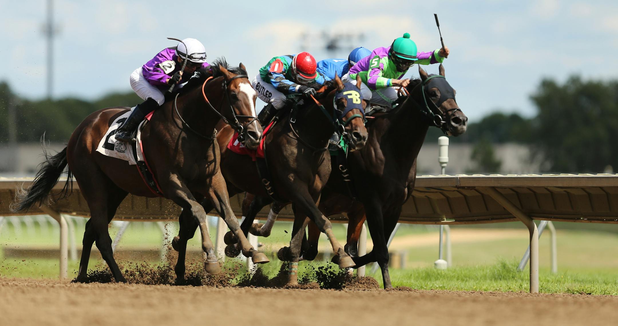FILE: Hold for More, ridden by jockey Dean Butler (center) pulls ahead of Bourbon County (left) and Smooth Chiraz (right) in the home stretch of the Crocrock Minnesota Sprint Championship last summer.
