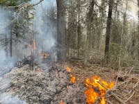 The Forest Service said a "spot fire" began in a controlled burn area northwest of Isabella, Minn. The fire is 75% contained Thursday afternoon.