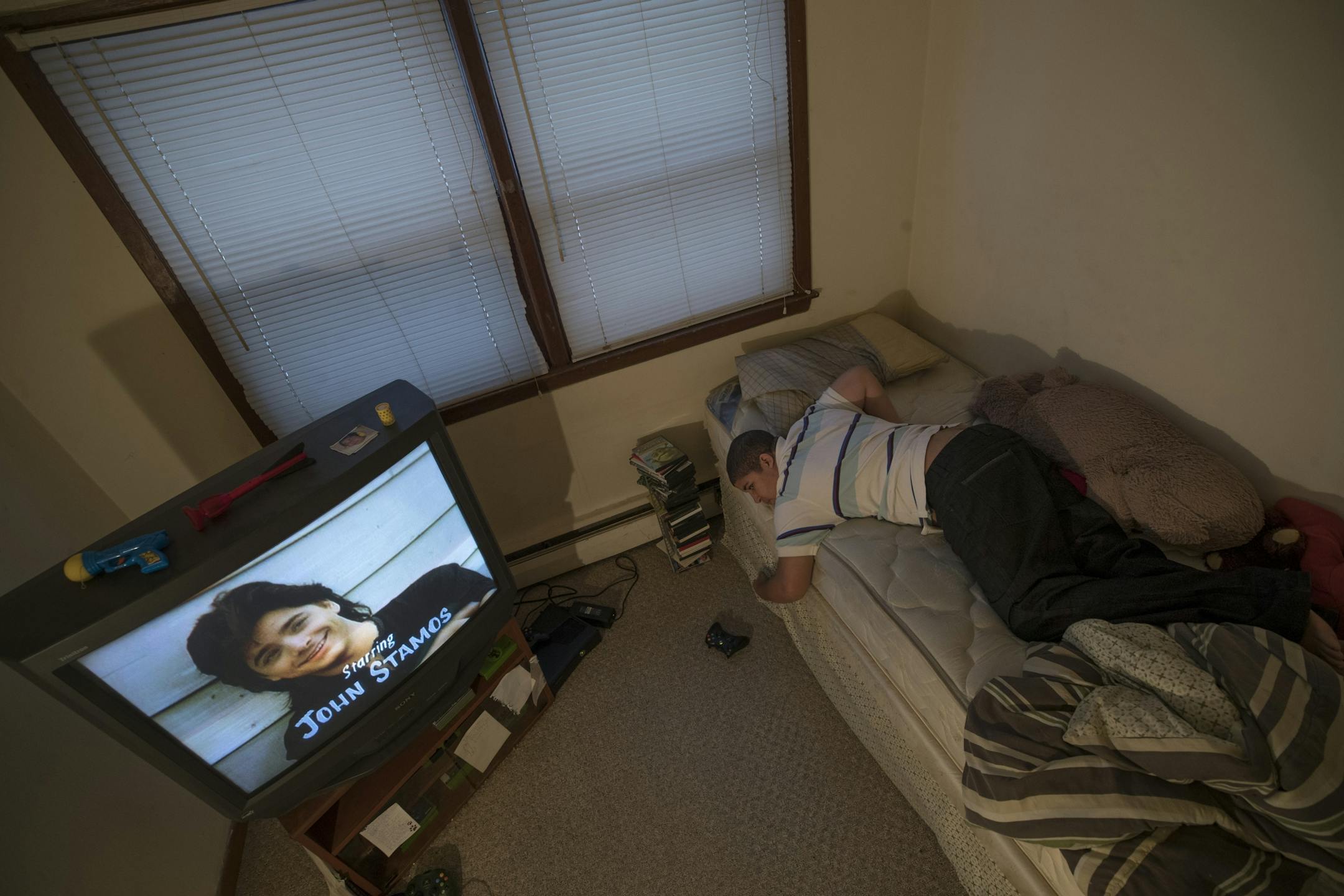 Jordan Mustin watched t.v in his apartment Thursday December 14, 2017 in Mounds View, MN. Jordan has autism and a history of violent outbursts toward himself and family.