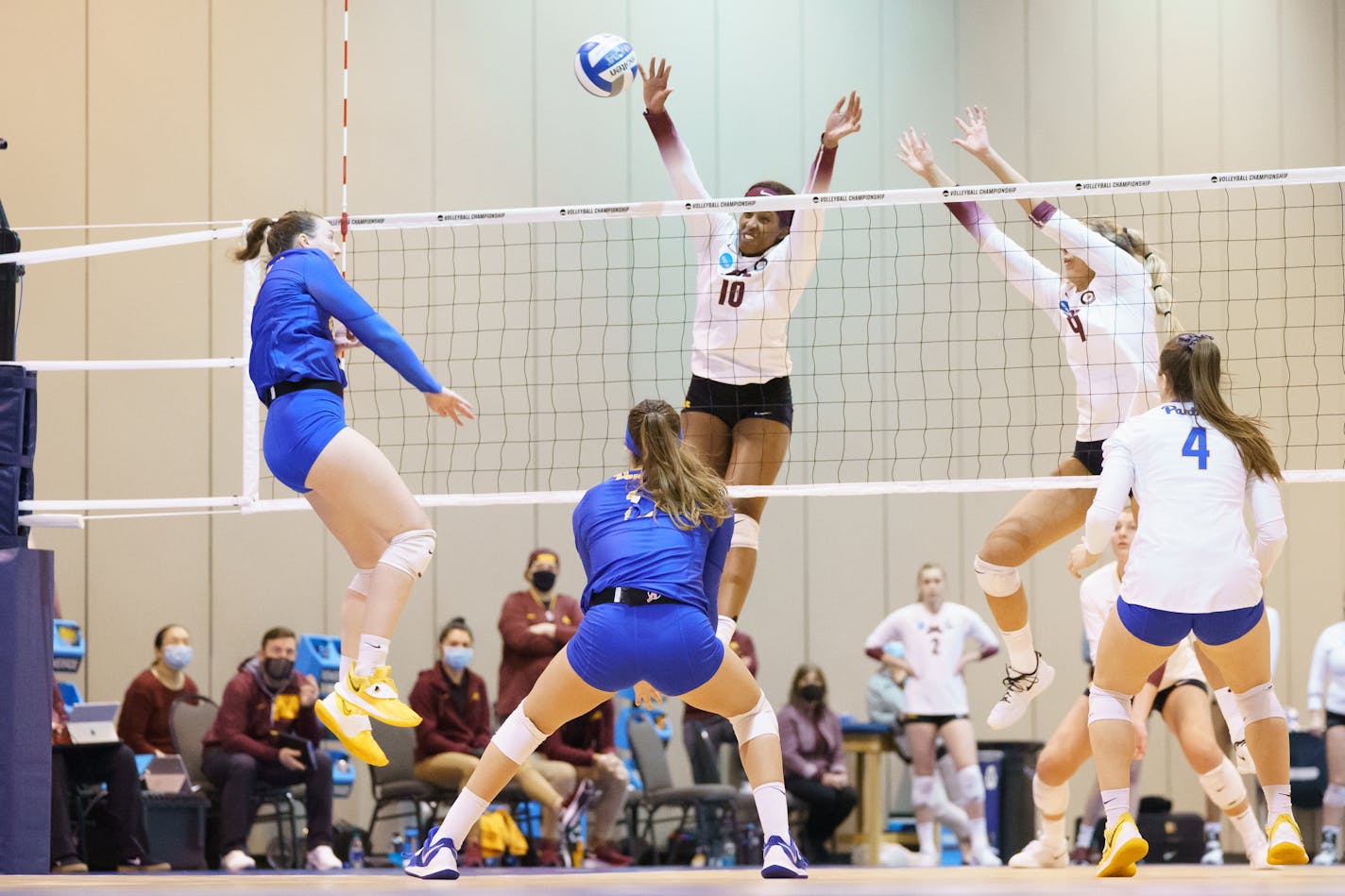 18 APR 2021: Pittsburgh vs. Minnesota during the Division I Women's Volleyball Tournament held at the CHI Health Center Omaha in Omaha, NE. Gophers defenders Stephanie Samedy (10) and Shea Rubright (9) attempt to block a shot by Pittsburgh's Kylee Levers. Mark Kuhlmann/NCAA Photos