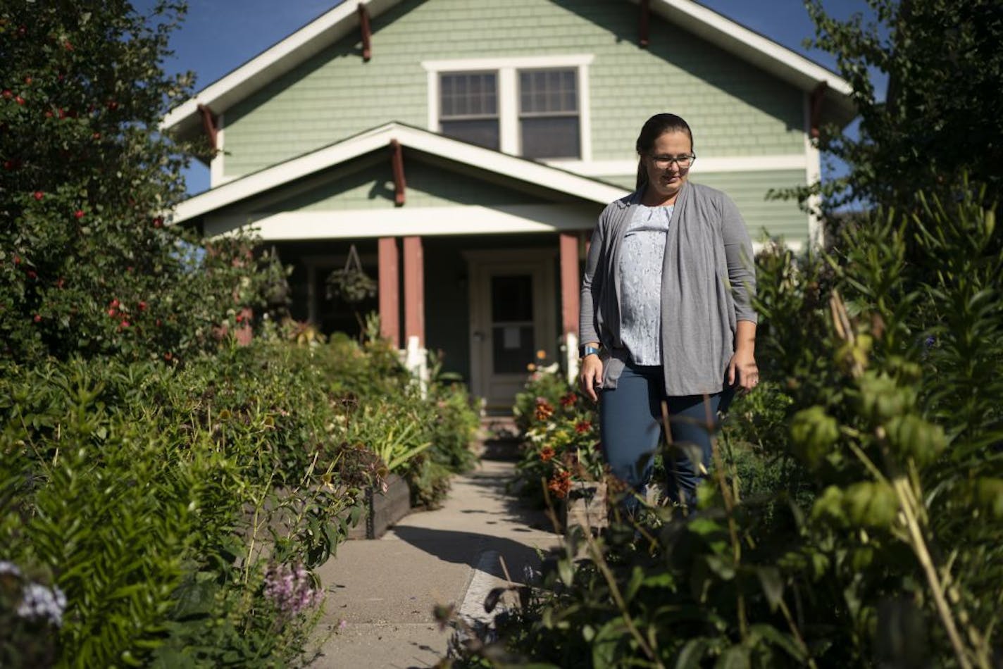 Jolene Johnson, seen Sept. 10, is frustrated that her homeowners association is forcing her to remove large sections of her garden, a garden she planted 12 years ago and takes great pride in.