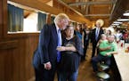 Republican presidential candidate Donald Trump hugs a patron during a visit to Stamey's Barbecue, Tuesday, Sept. 20, 2016, in Greensboro, N.C. (AP Pho