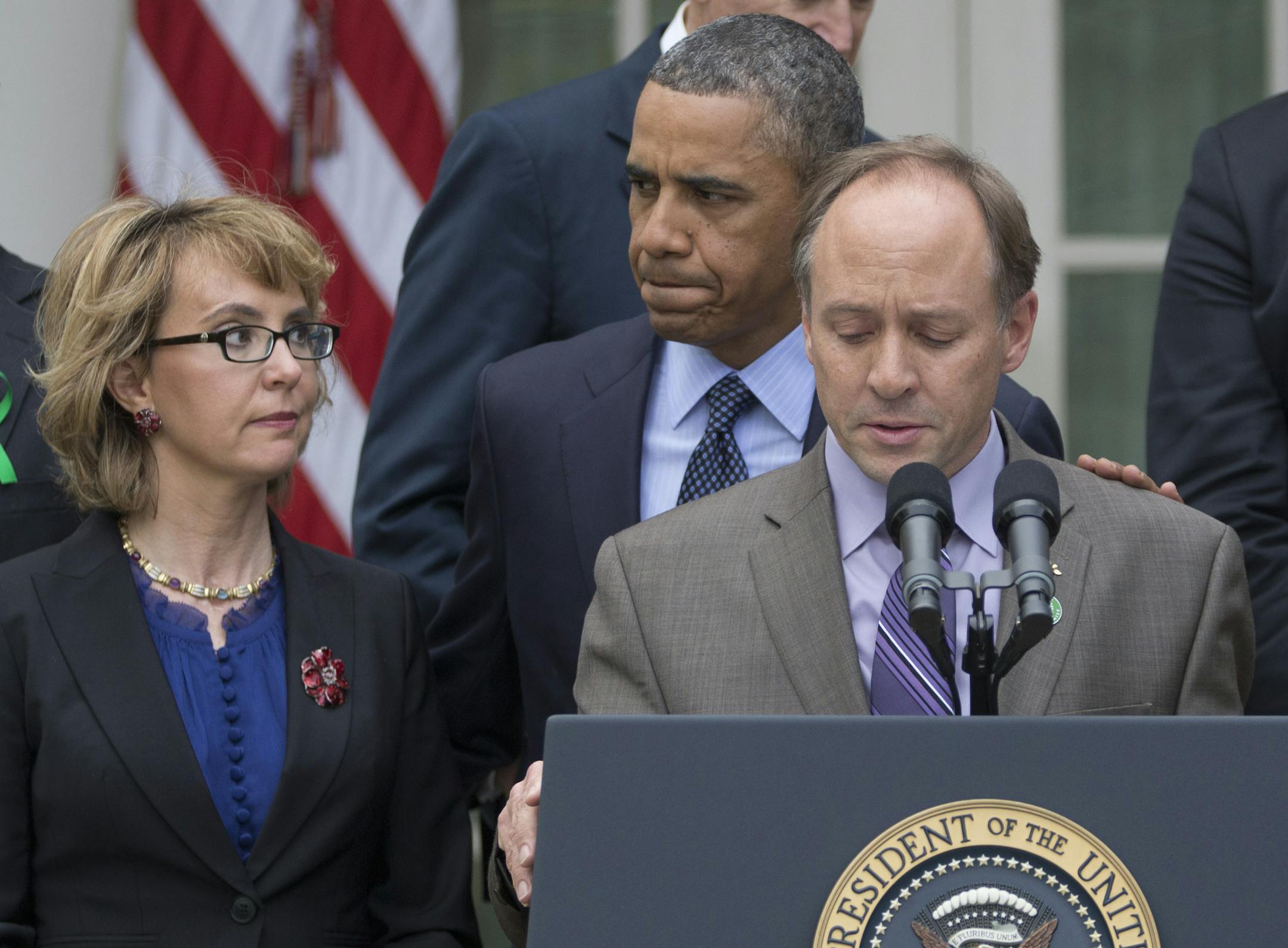 President Barack Obama arrives to participate in a news conference in the Rose Garden of the White House, Wednesday, April 17, 2013, in Washington, about measures to reduce gun violence. With Obama is former Rep. Gabby Giffords, left, and Mark Barden, the father of Newtown shooting victim Daniel. (AP Photo/Carolyn Kaster)