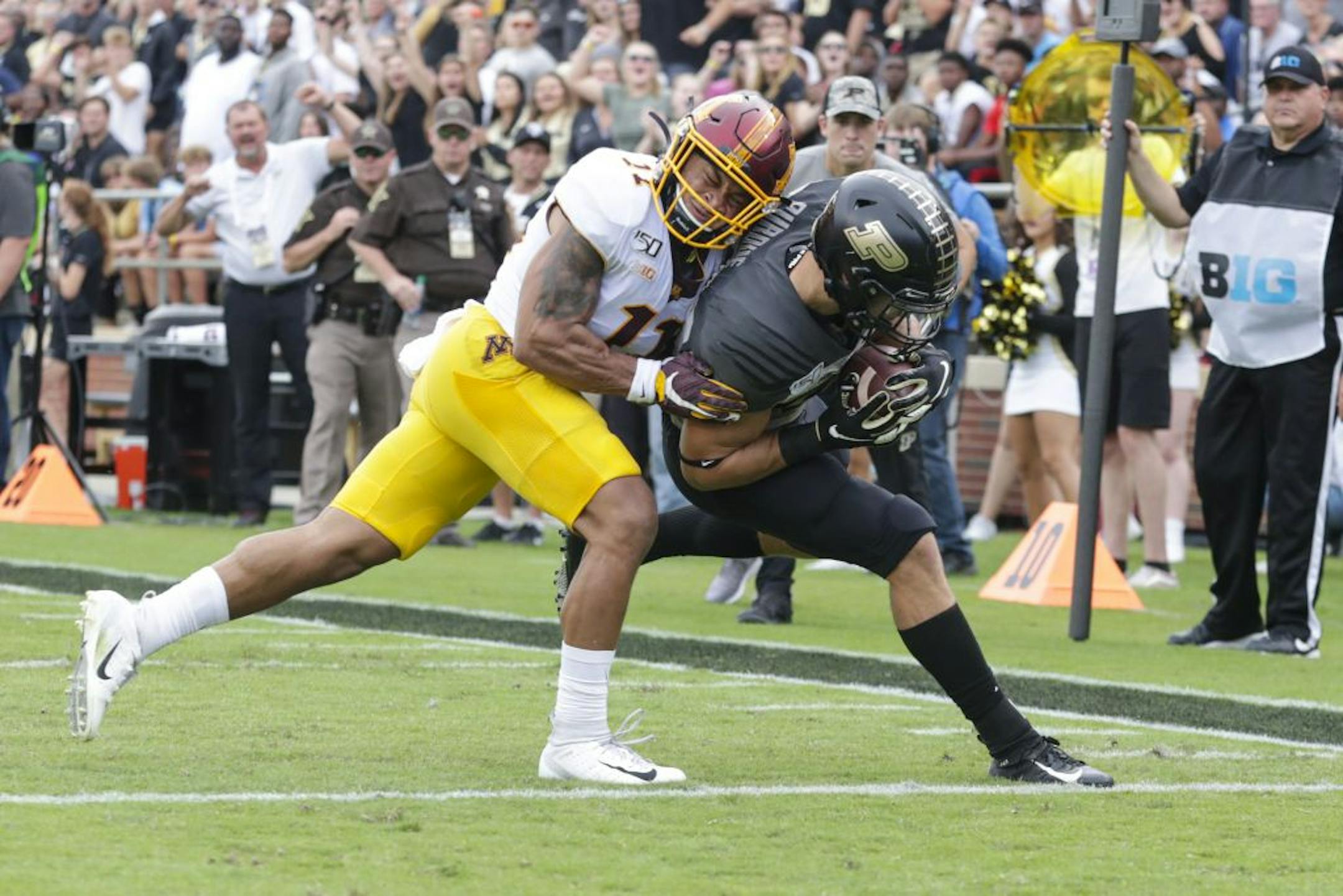 Purdue running back Zander Horvath (40) runs in for a touchdown in front of Minnesota defensive back Antoine Winfield Jr. (11) during the first half of an NCAA college football game in West Lafayette, Ind., Saturday, Sept. 28, 2019.