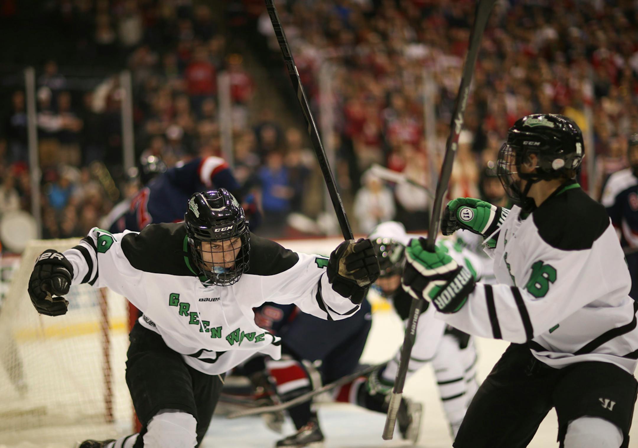 East Grand Forks winger Tanner Tweten celebrated his first first period goal on Orono to put the Green Wave ahead 2-0. At right was his teammate Taylor Brierley.
