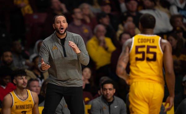 Gophers coach Ben Johnson recruited point guard Ta’Lon Cooper (55) as a transfer, only to lose him last month to South Carolina. 