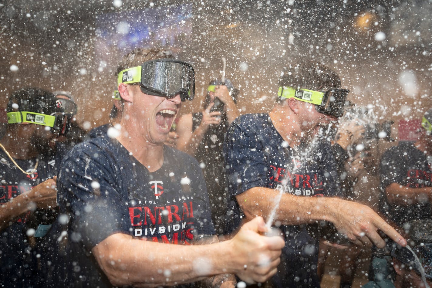 Twins players celebrate with champagne in the locker room after clentched the American League Central title. The Minnesota Twins hosted the Los Angeles Angels at Target Field on Friday, Sept. 22, 2023 in Minneapolis, Minn. ] RENEE JONES SCHNEIDER • renee.jones@startribune.com