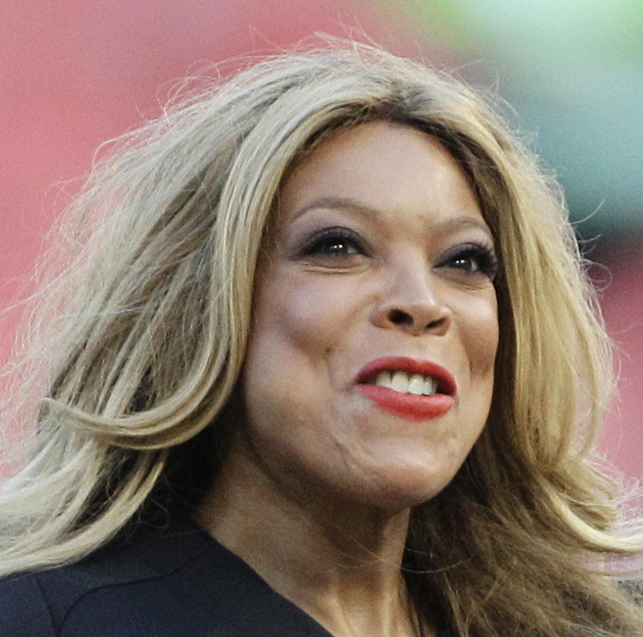 TV personality Wendy Williams throws out the first ceremonial pitch before the baseball game between the St. Louis Cardinals and Florida Marlins in Miami, Thursday, Aug. 4, 2011. The Cardinals won 7-4. (AP Photo/J Pat Carter)