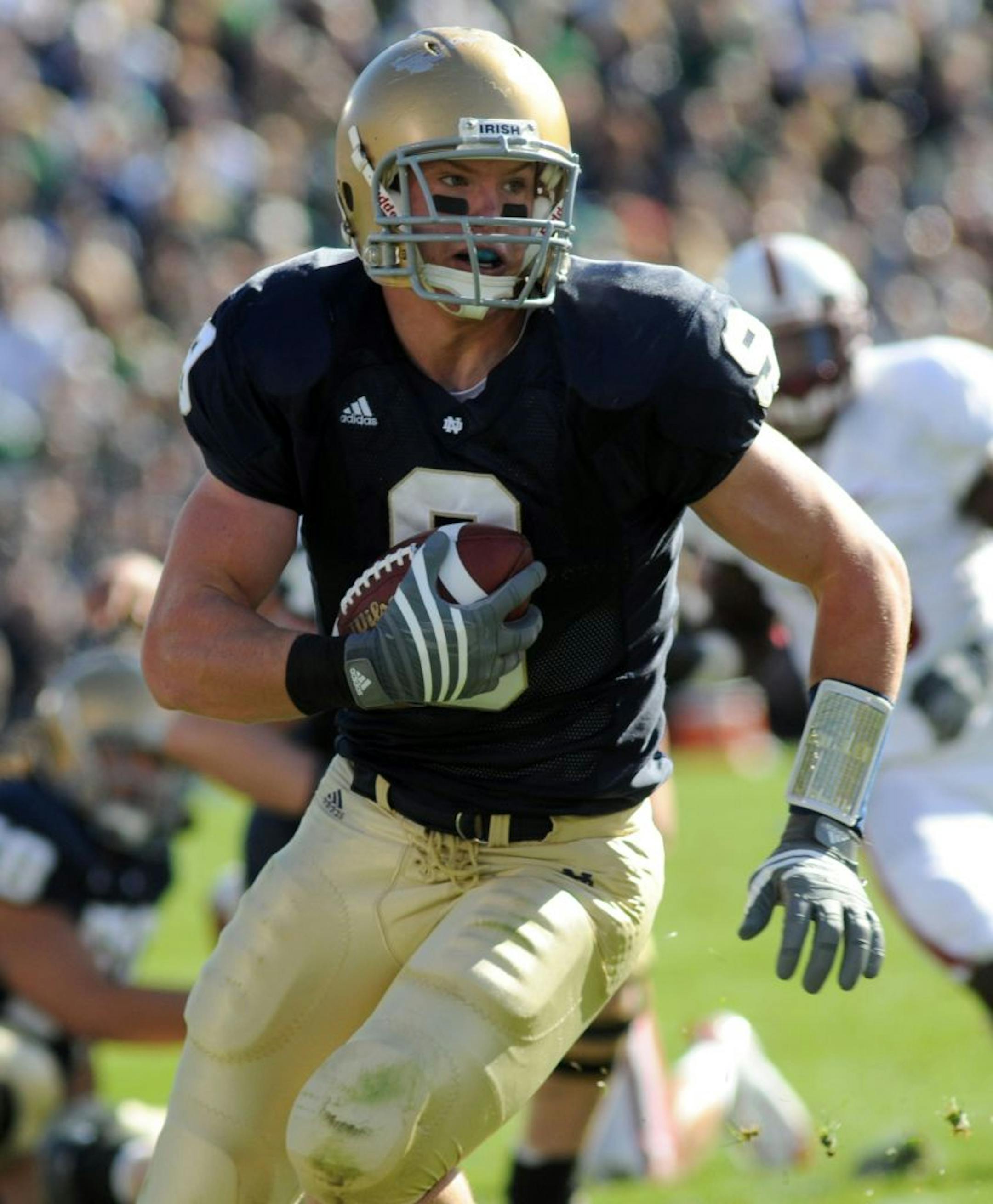 In this Oct. 14, 2008 photo, Notre Dame tight end Kyle Rudolph heads up field after making a catch during an NCAA college football game against Stanford in South Bend, Ind.