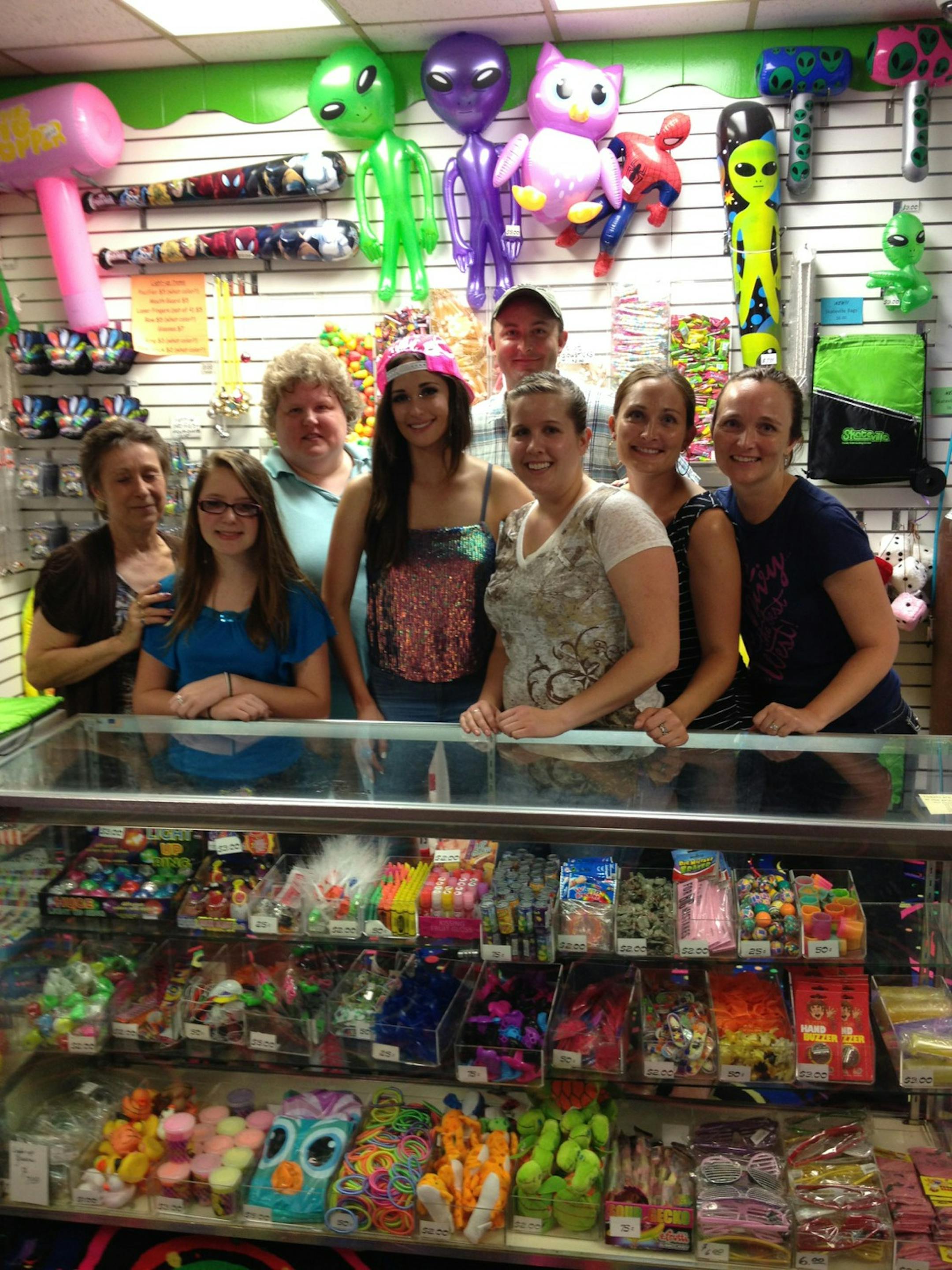 Singer Kacey Musgraves, center, hangs out with patrons and workers at Skateville in Burnsville.