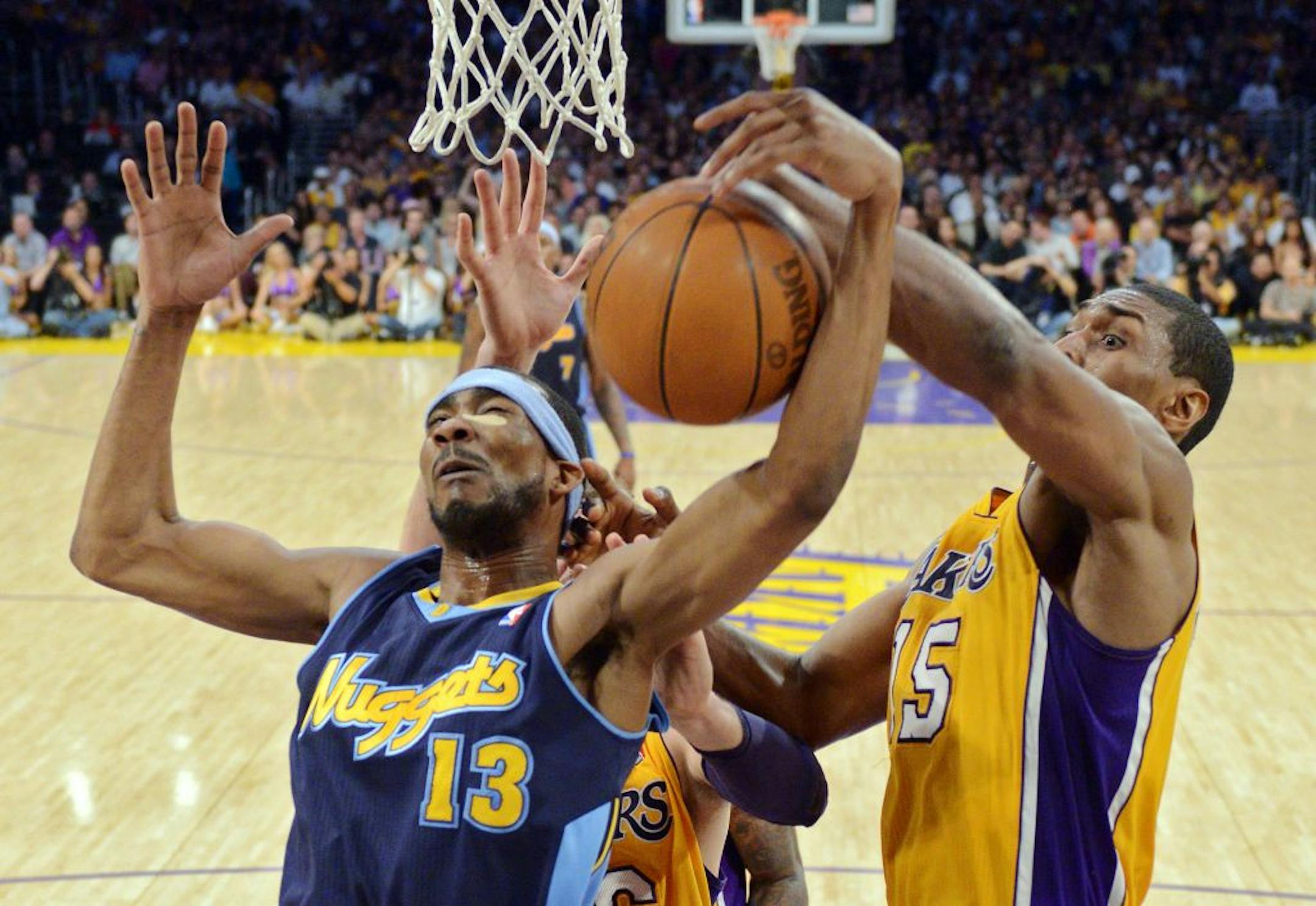 Corey Brewer, left, and Los Angeles Lakers forward Metta World Peace during the 2012 NBA playoffs.