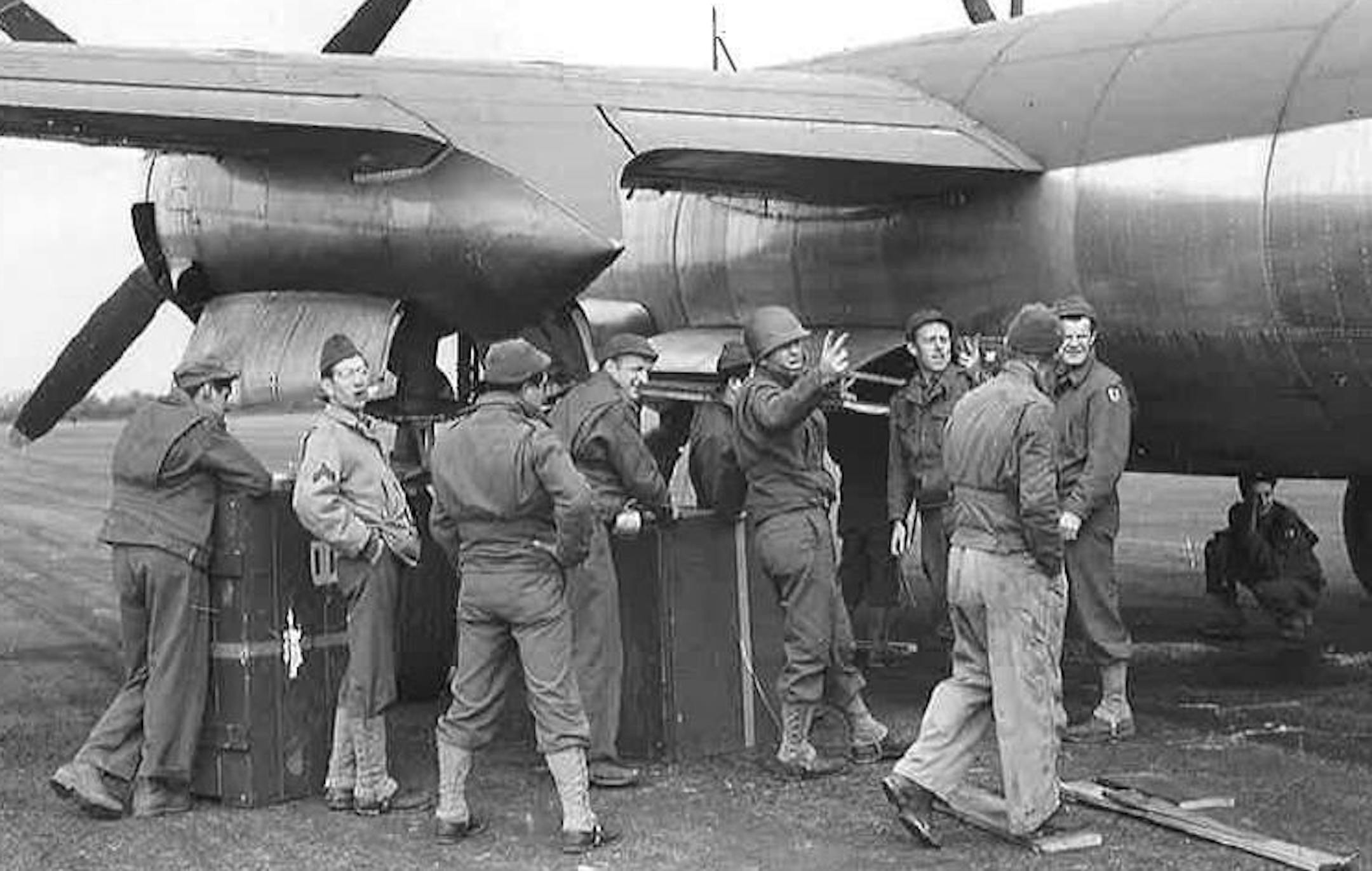 Cpl. Lloyd J. Hughes, second from left, was with the 480th Air Service Group in Europe loading supplies in 1944. Son Bruce Hughes of Brooklyn Park sent in the photo.