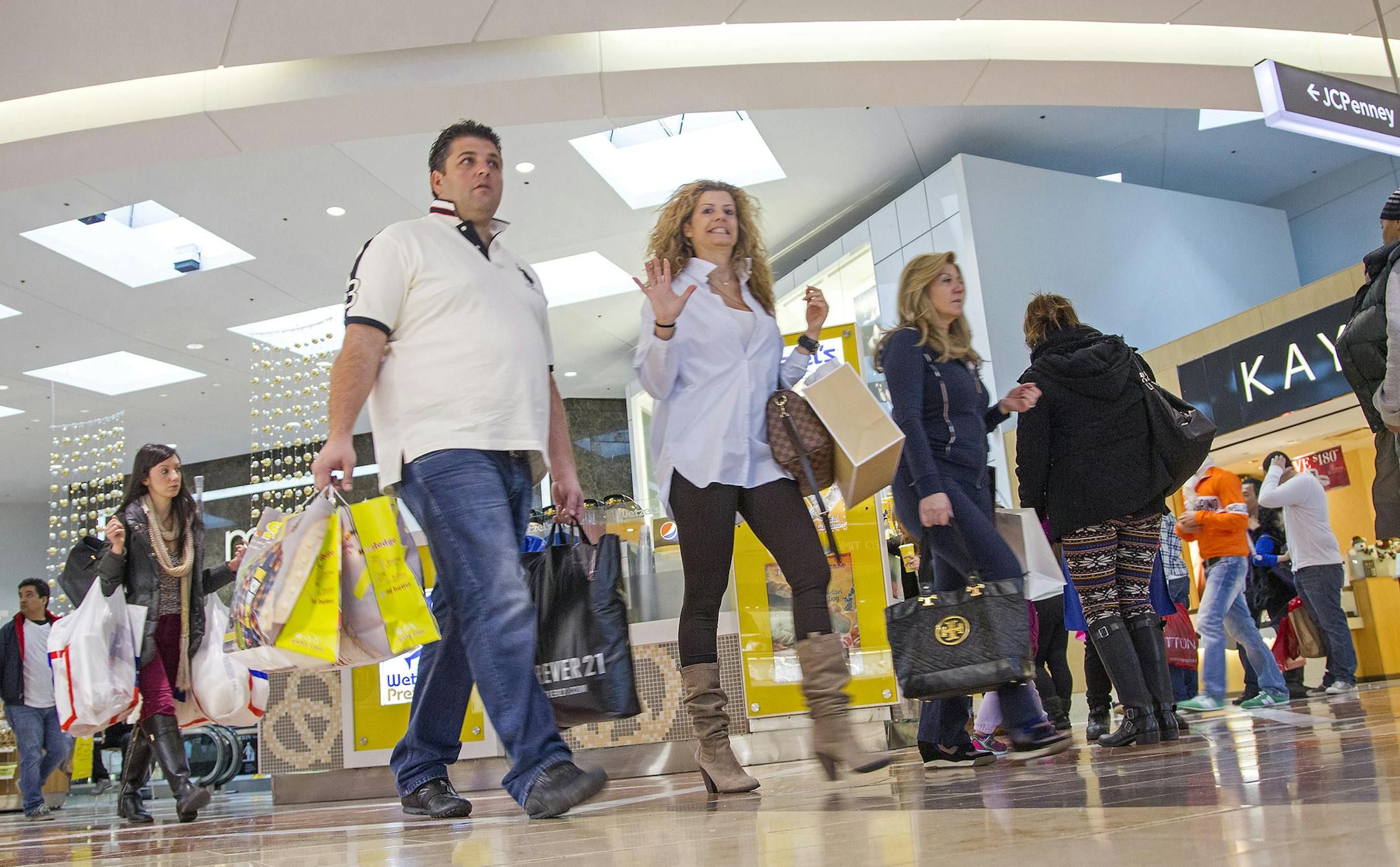 Shoppers on the lookout for post-Christmas sales and looking to return presents from the previous day flocked to the Garden State Plaza Mall in Paramus. Thursday, Dec. 26, 2013, in Paramus, N.J. (AP Photo/The Record of Bergen County, Tim Farrell) ONLINE OUT; MAGS OUT; TV OUT; INTERNET OUT; NO ARCHIVING; MANDATORY CREDIT