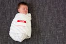 credit: Mie Ahmt, iStock Cute baby with "Hello, my name is" name tag on. ORG XMIT: MIN1307161602591158