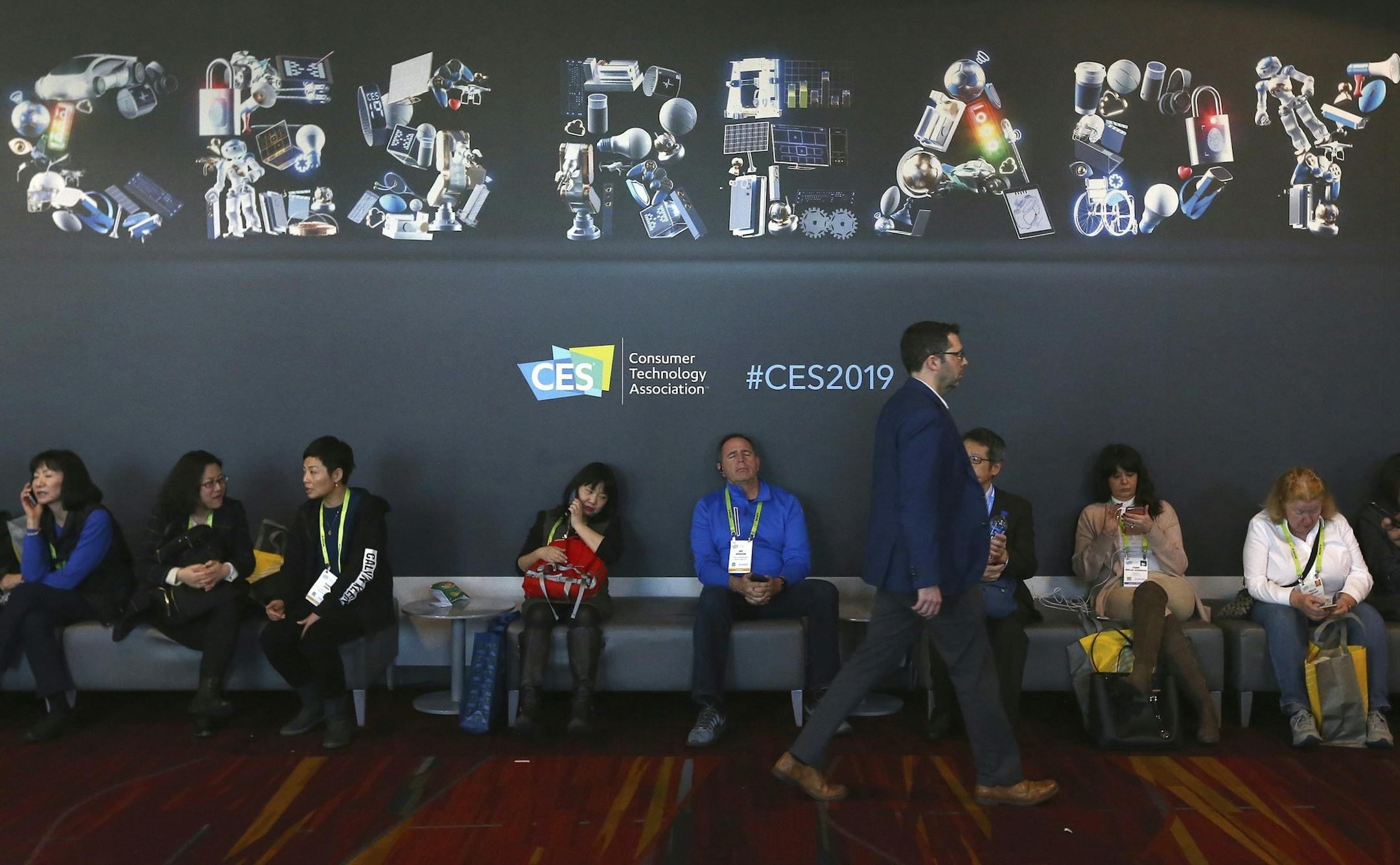 Attendees at CES International Wednesday, Jan. 9, 2019, in Las Vegas. (AP Photo/Ross D. Franklin) ORG XMIT: NVRF314