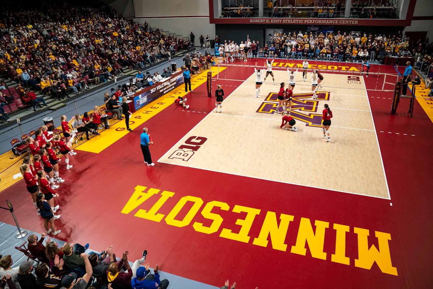 The University of Minnesota volleyball team celebrates after winning a point in the first second against the University of South Dakota in the first round of the NCAA tournament Friday, Dec. 3, 2021 in Maturi Pavilion in Minneapolis, Minn. ]