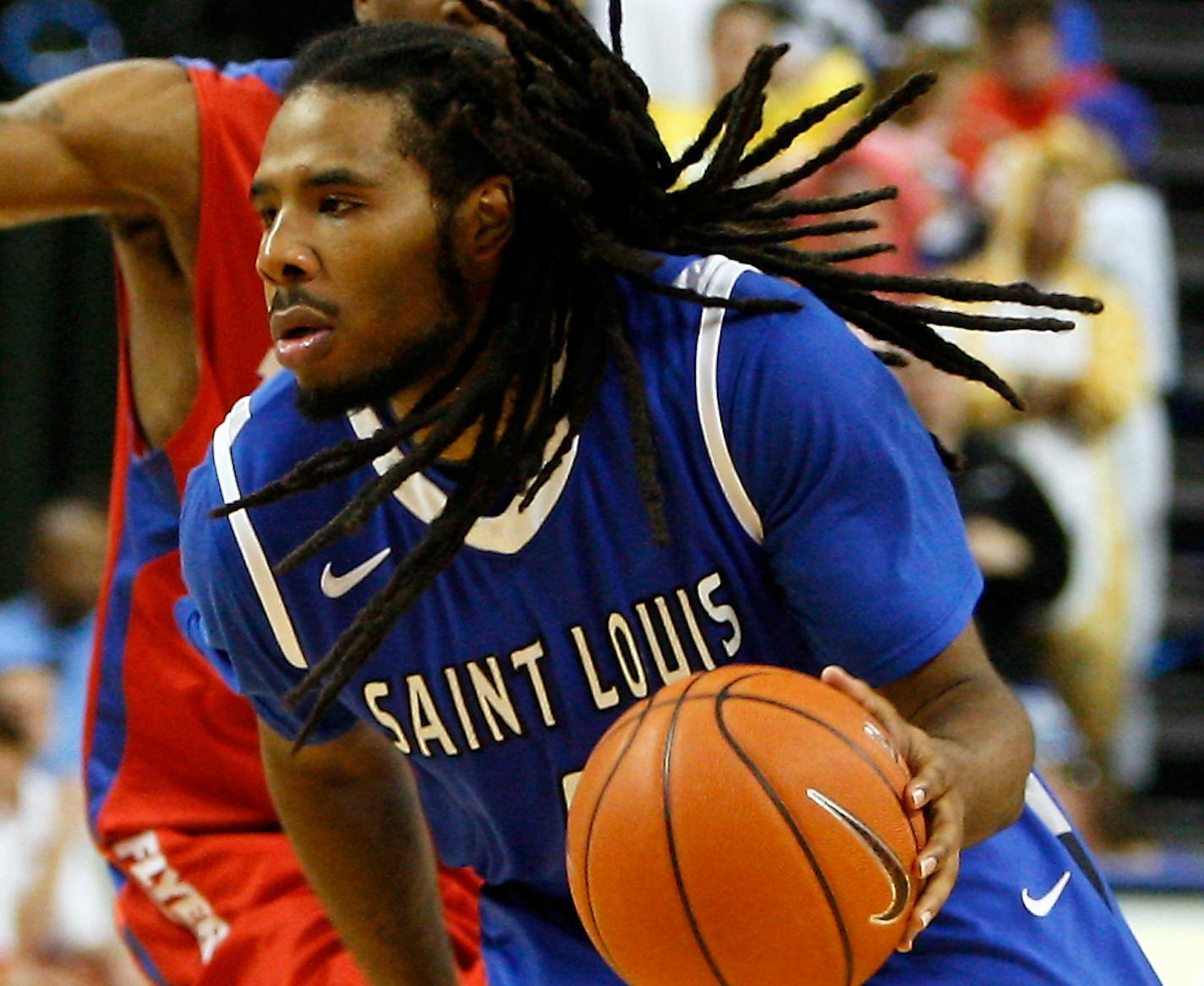 Saint Louis' Jordair Jett (5) drives to the basket during the second half of an NCAA college basketball game against Dayton Wednesday, Mar. 5, 2014, in St. Louis. (AP Photo/Scott Kane) ORG XMIT: MOSK