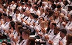 Medical students applaud during the University of Minnesota Medical School's annual White Coat Ceremony for the class of 2026 Friday, Aug. 19, 2022 at