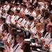 Medical students applaud during the University of Minnesota Medical School's annual White Coat Ceremony for the class of 2026 Friday, Aug. 19, 2022 at