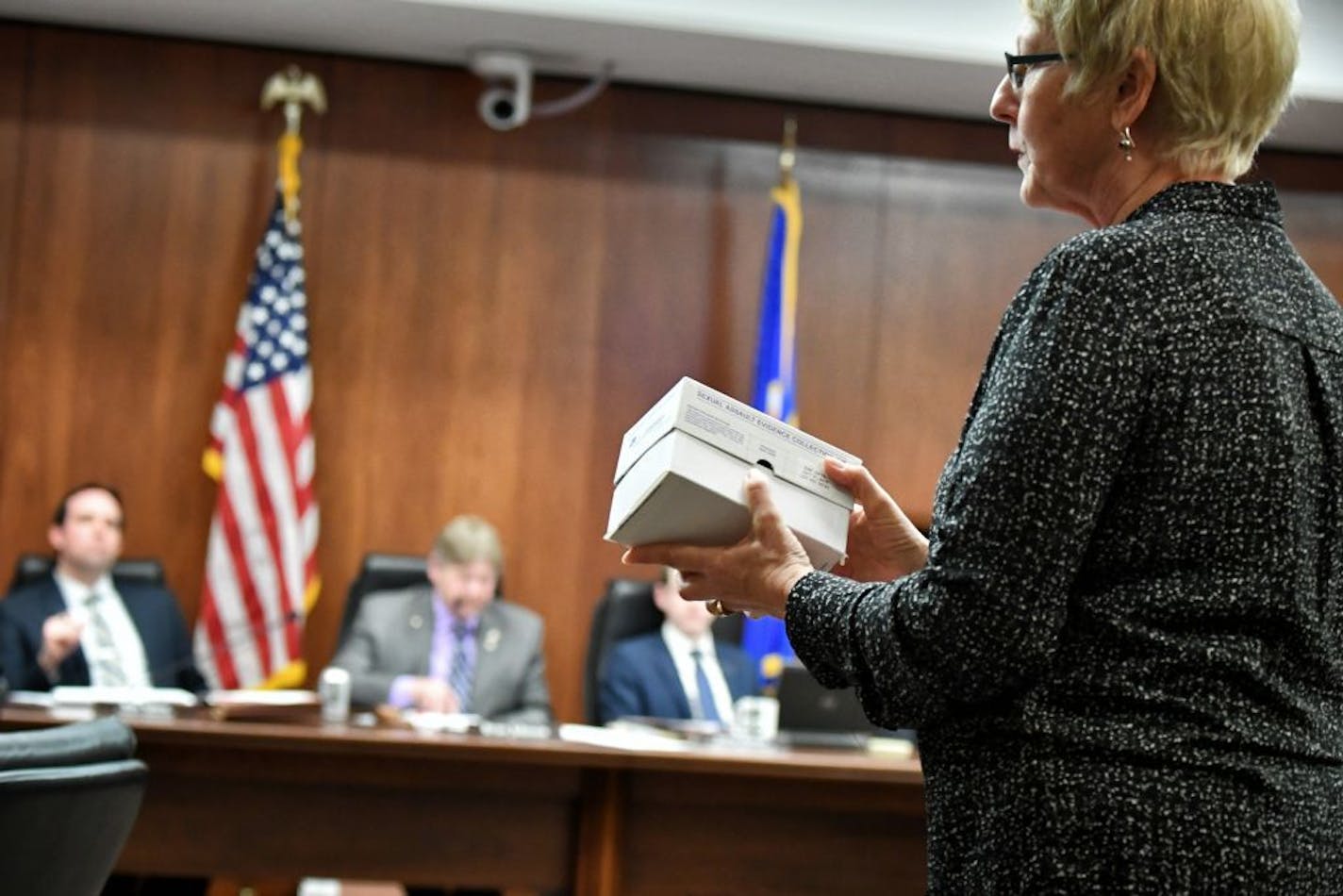 Linda Walther, a sexual assault nurse examiner, asked members of the House Public Safety Committee members to examine a sexual assault kit. Under a new plan, the state's law enforcement agencies would get clear, mandated timetables for testing the kits.