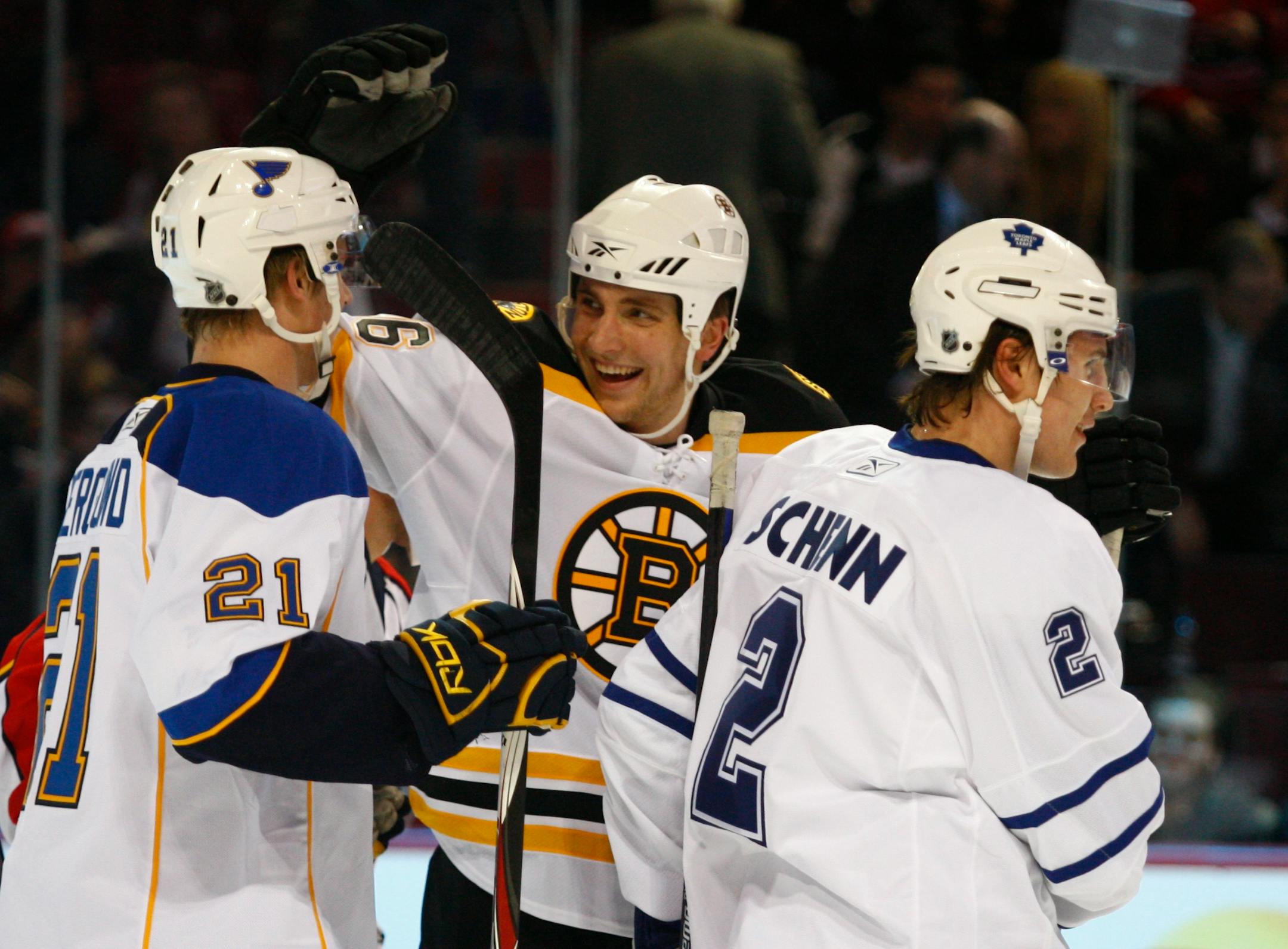 Team Rookies Luke Schenn, right,, of the Toronto Maple Leafs, skates past as Team Rookies' Patrik Berglund, left , of the St. Louis Blues, and Blake Wheeler, of the Boston Bruins celebrate during the YoungStars game at the NHL All-Star weekend in Montreal, Saturday Jan. 24, 2009.