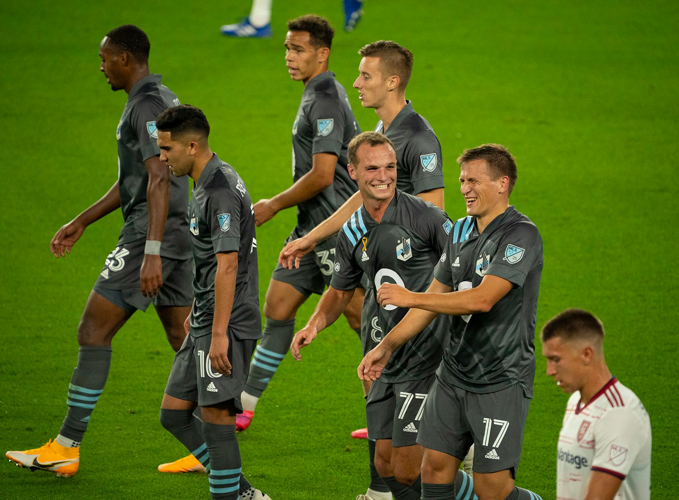 Minnesota United attacker Robin Lod (17) laughed as he celebrated his second half goal with teammate Chase Gasper (77).