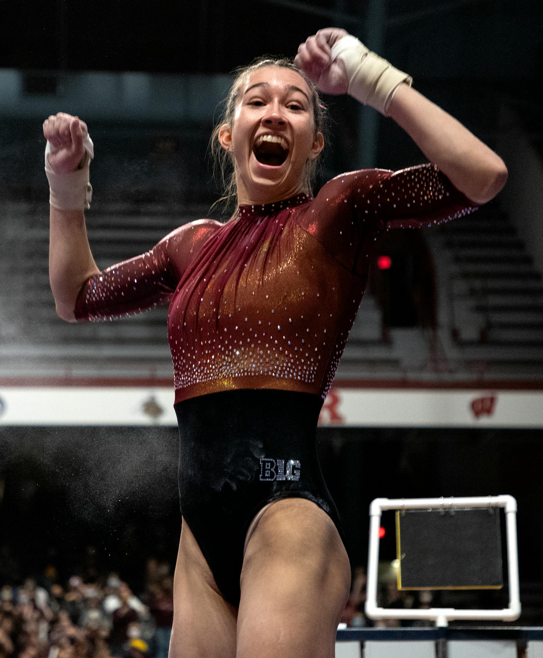 Ona Loper of Minnesota reacts after competing in the vault.