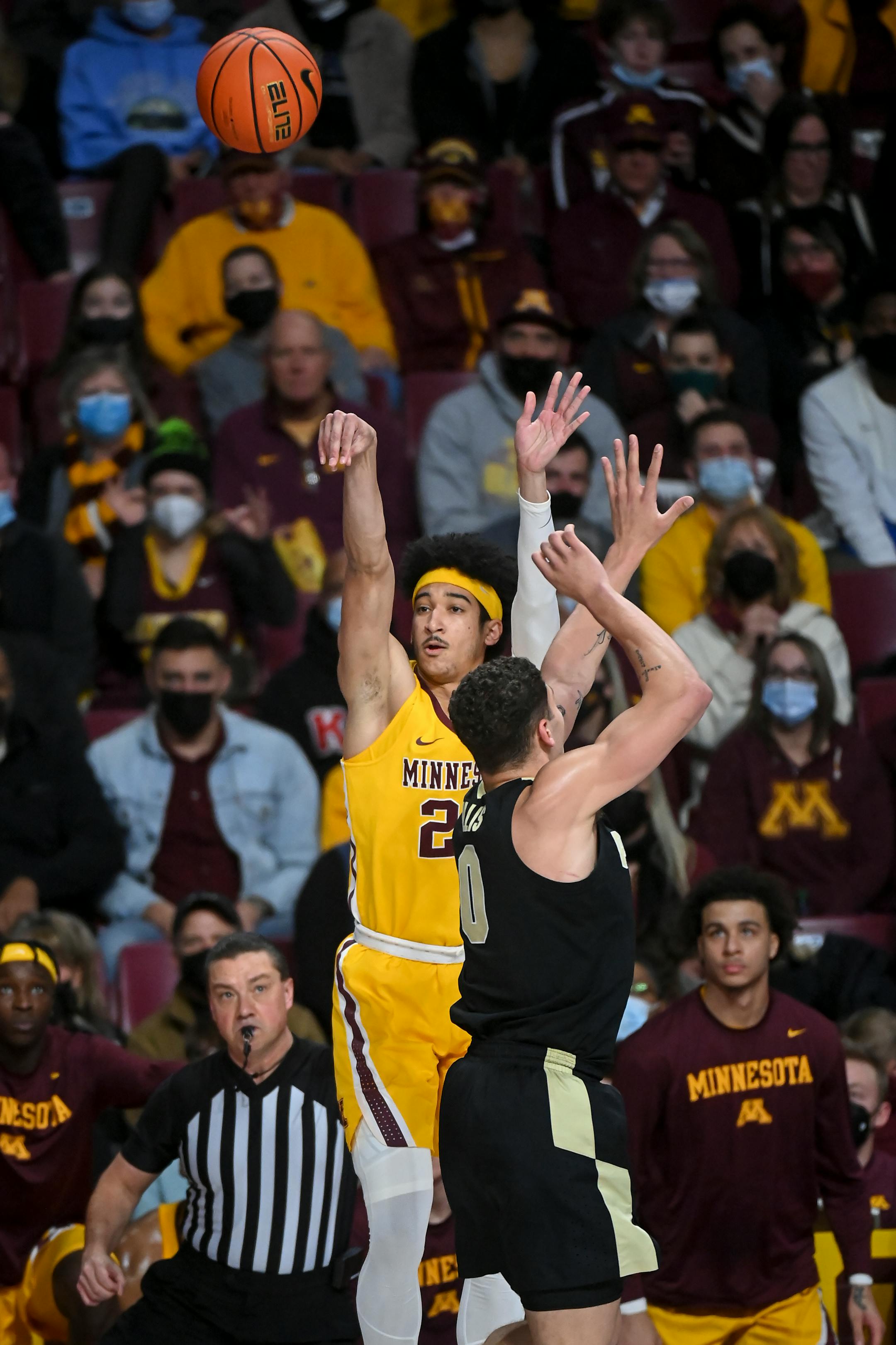 Minnesota Gophers guard E.J. Stephens (20) scores a 3-pointer against Purdue Boilermakers forward Mason Gillis (0) during the second half of an NCAA men's basketball game between Minnesota and Purdue at Williams Arena in Minneapolis, Minn.
