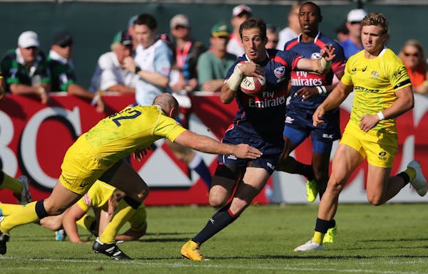 U.S. player Zack Test ran with the ball during a rugby match of HSBC Sevens World Series in Dubai, United Arab Emirates in December. A University of M