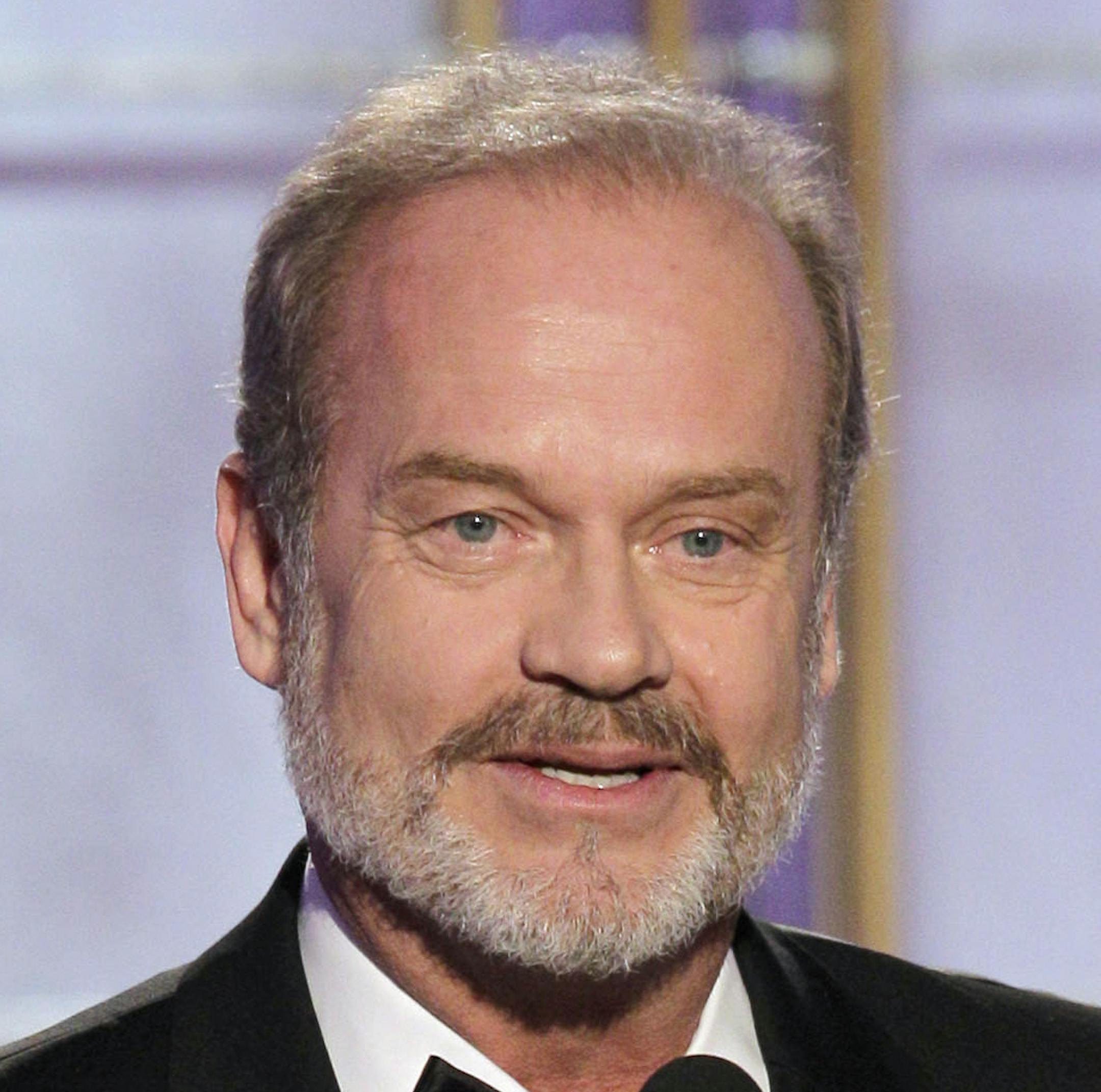 In this image released by NBC, Kelsey Grammer accepts the Best Actor in a TV Series Drama for his role in "Boss," during the 69th Annual Golden Globe Awards, Sunday, Jan. 15, 2012 in Los Angeles. (AP Photo/NBC, Paul Drinkwater)