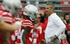Ohio State head coach Urban Meyer watches his team warm up before an NCAA college football game against Tulane Saturday, Sept. 22, 2018, in Columbus, 