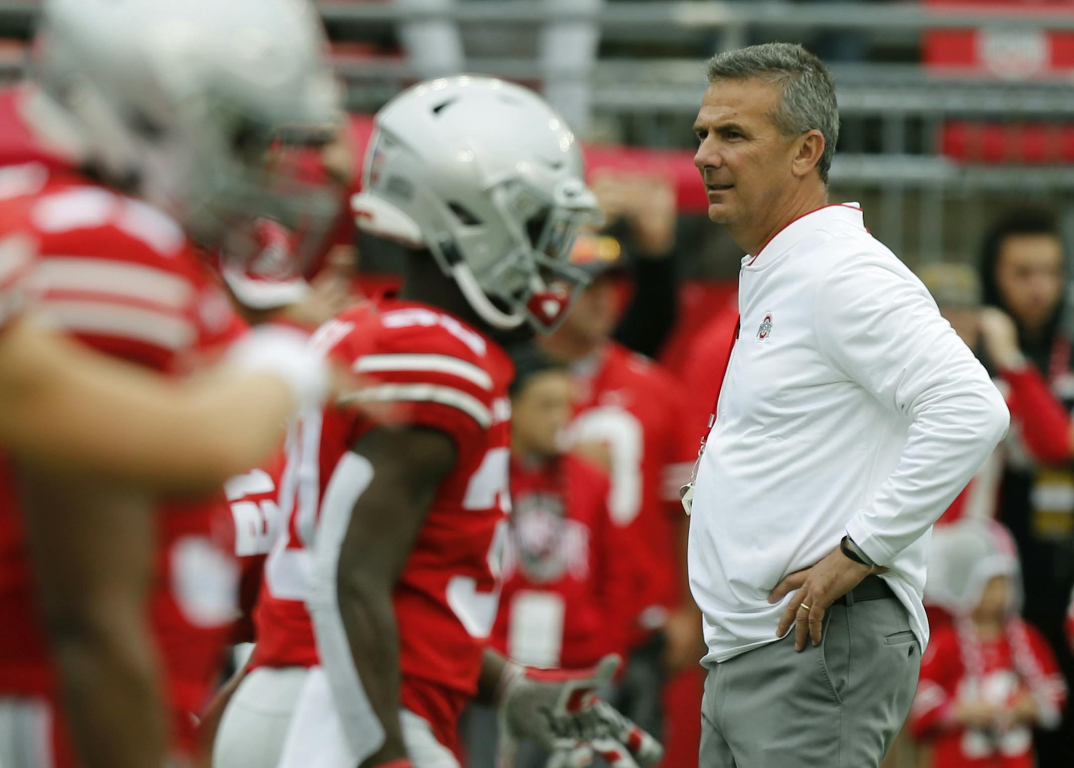 Ohio State head coach Urban Meyer watches his team warm up before an NCAA college football game against Tulane Saturday, Sept. 22, 2018, in Columbus, Ohio. Meyer is returning to his coaching duties after a three-game suspension. (AP Photo/Jay LaPrete)
