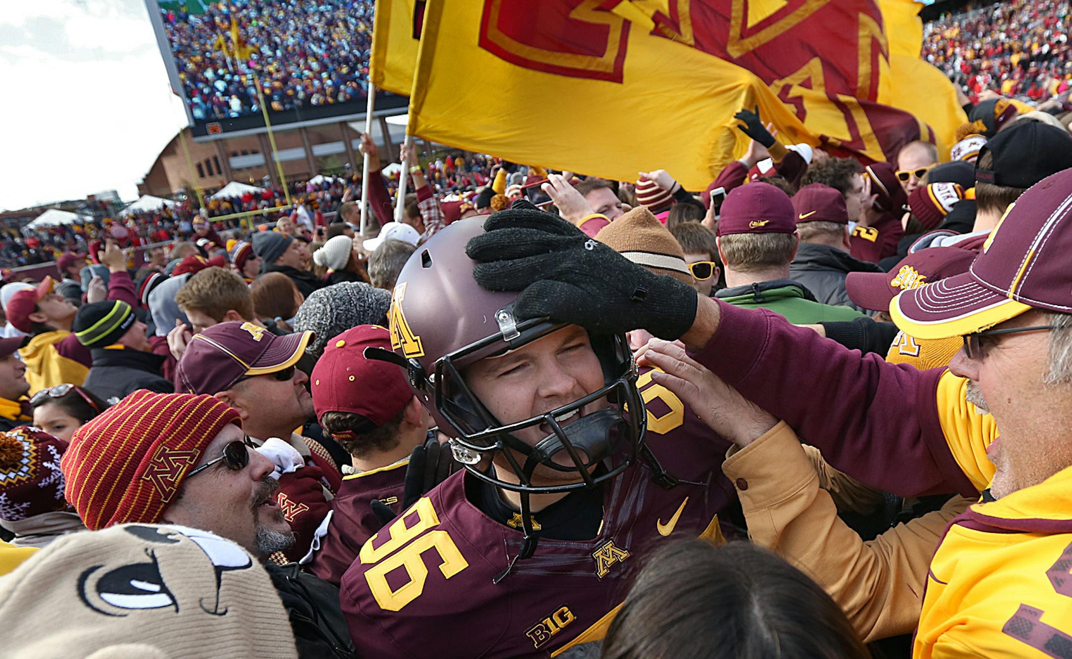 Gophers Jordan Hinojosa was mobbed by enthusiastic fans after the victory over Nebraska.