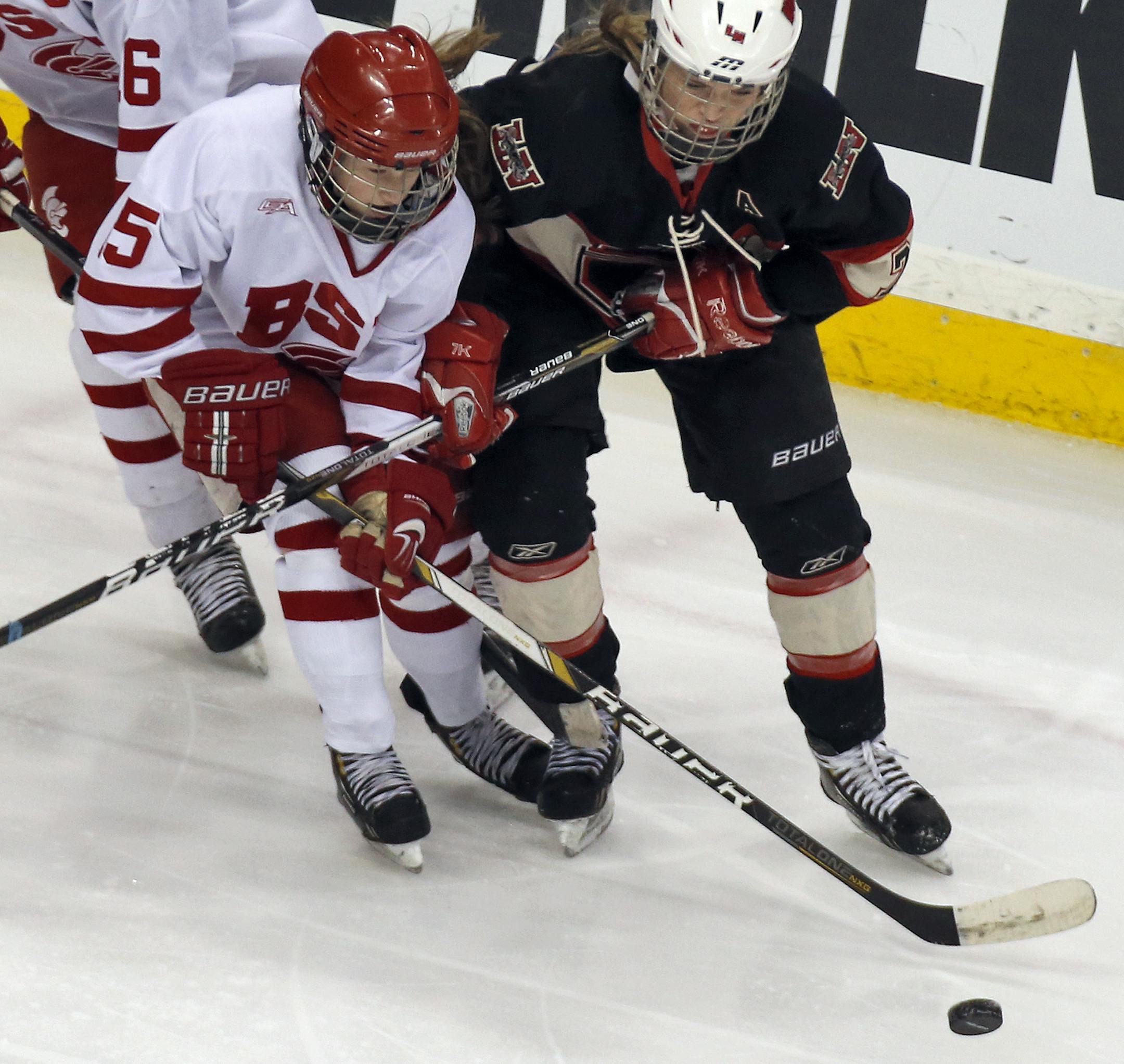 Girls Class 2A State Hockey Semifinals - Lakeville North Panthers vs. Benilde St. Margaret's Red Knights. Red Knights Sydney Simone, left, and Erin Olson fought for control of the puck. (MARLIN LEVISON/STARTRIBUNE(mlevison@startribune.com)
