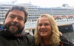 Rodney Horgen and Judy Lemieux, at their hotel in Molde, Norway. The troubled ship they were on is in the background.