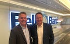 Executive Vice President Todd Lee and CEO Michael Solberg outside Bell Bank’s new City Center office in downtown Minneapolis.