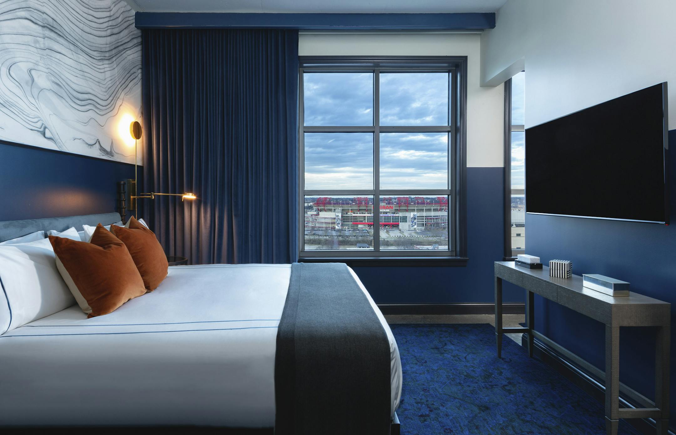 PHOTO MOVED IN ADVANCE AND NOT FOR USE - ONLINE OR IN PRINT - BEFORE JUNE 30, 2019. — In a photo from Edward Menashy, a "bronze king" room at Dream Nashville, Printers Alley. With a soft launch in December, the 168-room boutique hotel opened officially in March after a campaign to win over locals reeling from a breakneck building boom. (Edward Menashy via The New York Times) -- NO SALES; FOR EDITORIAL USE ONLY WITH NYT STORY NASHVILLE HOTEL ADV30 BY KIM GREEN FOR JUNE 30, 2019. ALL OTHER